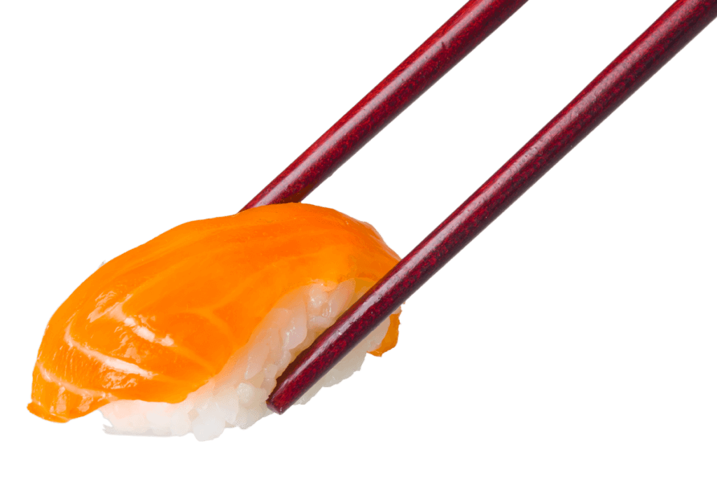 Close-up of salmon nigiri sushi held by chopsticks, showcasing fresh fish on vinegared rice